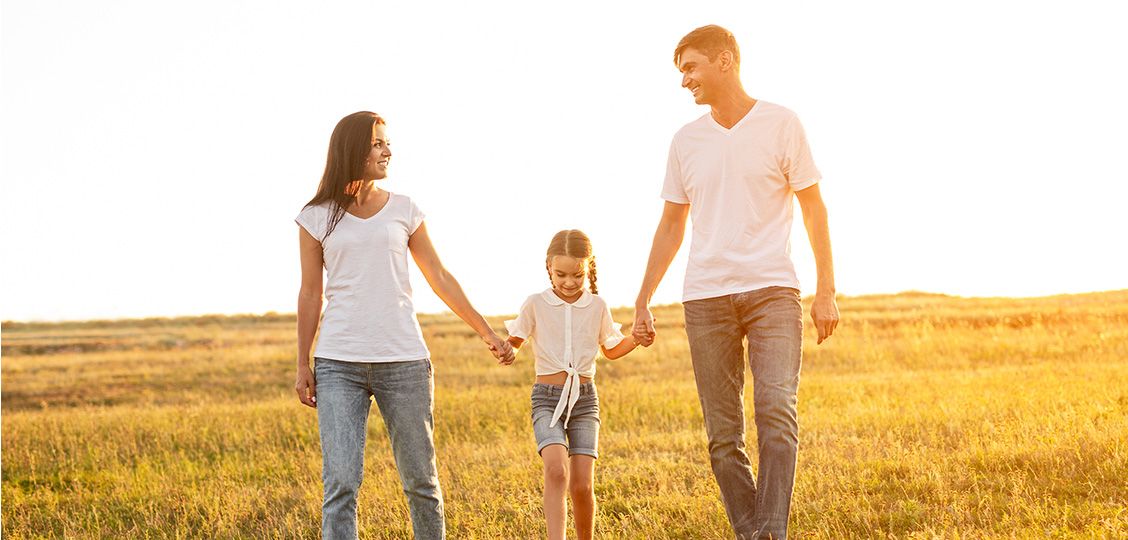 family with kid on sunset